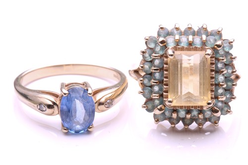 Lot 144 - A pale sapphire ring; the oval cut sapphire in...