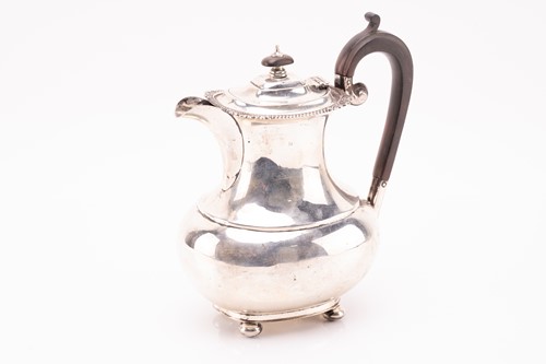 Lot 371 - A silver hot water jug; low bellied...