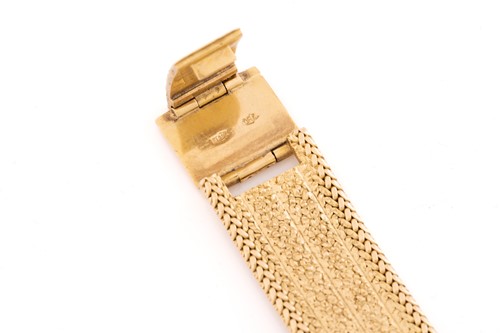 Lot 288 - An 18mm woven yellow metal strap stamped '750'...