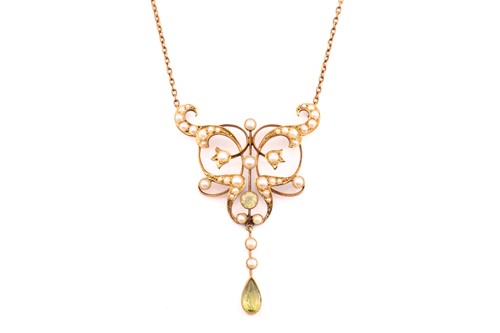 Lot 265 - An Edwardian peridot and seed pearl pendant...