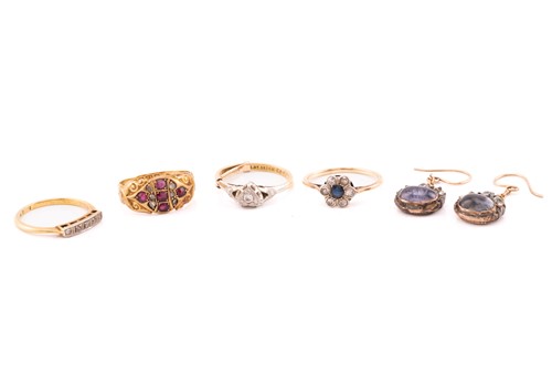 Lot 184 - A collection of four gem-set rings, together...