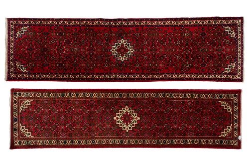 Lot 558 - Two similar red-ground modern Hussainabad...