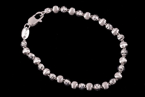 Lot 124 - A bead link bracelet, alternating with faceted...