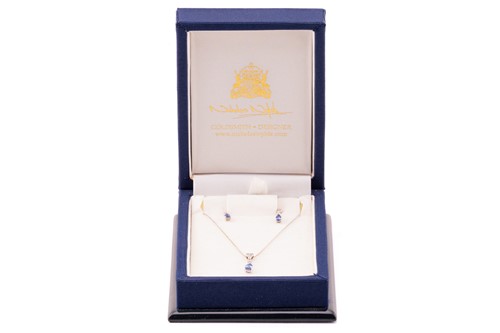 Lot 15 - A sapphire and diamond necklace and earrings...