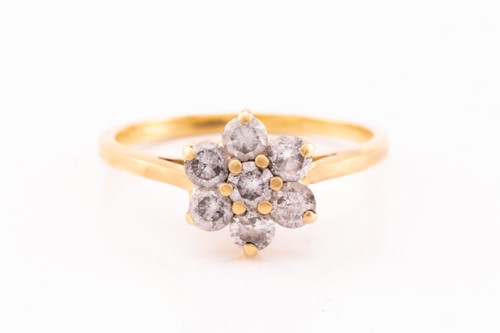 Lot 119 - A diamond cluster ring, featuring seven round...