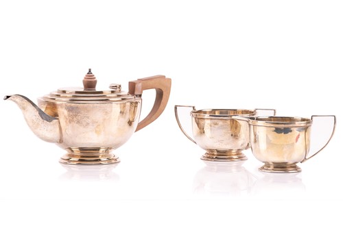 Lot 386 - A three piece Art Deco silver tea set, of...