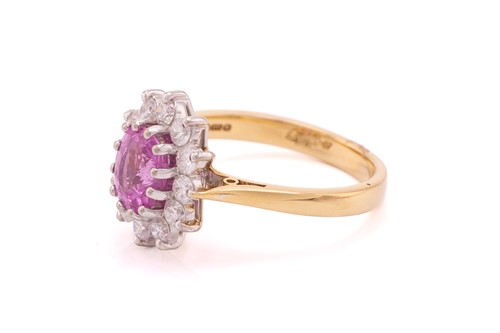 Lot 68 - A pink sapphire and diamond cluster ring in...