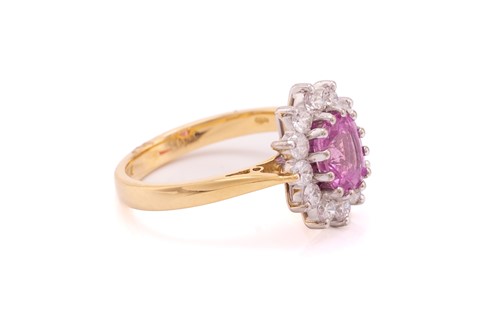 Lot 68 - A pink sapphire and diamond cluster ring in...