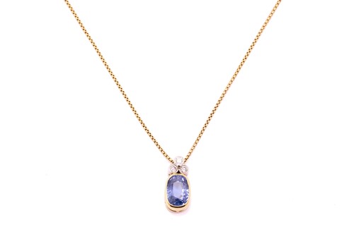 Lot 99 - A sapphire and diamond pendant on chain, the...