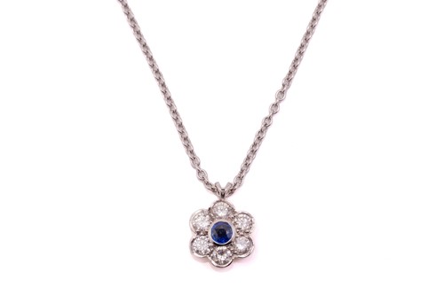 Lot 266 - A sapphire and diamond cluster pendant on...