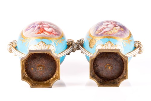 Lot 572 - A pair of Sevres bleu celeste style porcelain...