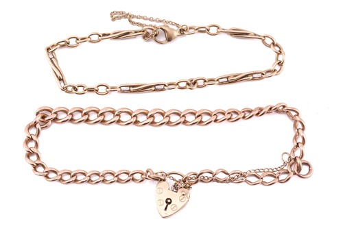 Lot 261 - A 9ct pink gold bracelet with a heart padlock...