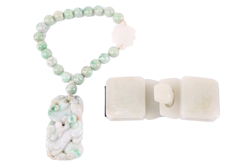 Lot 525 - A Chinese Nephrite jade buckle, the panels...