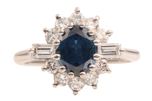 Lot 211 - A sapphire and diamond cluster ring in 18ct...