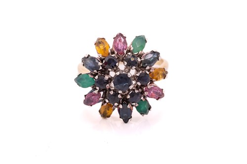 Lot 212 - A gem-set flower dome ring, centred with a...