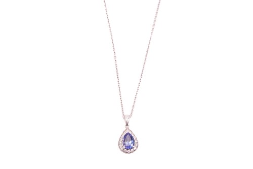 Lot 107 - A tanzanite and diamond cluster pendant on...