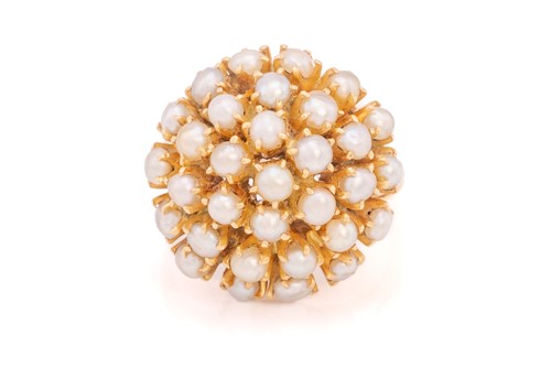 Lot 137 - A seed pearl cocktail bombé ring, comprising a...