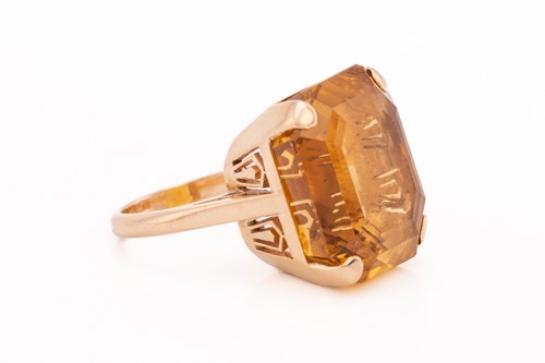 Lot 48 - A citrine brooch, matching earrings and a ring...