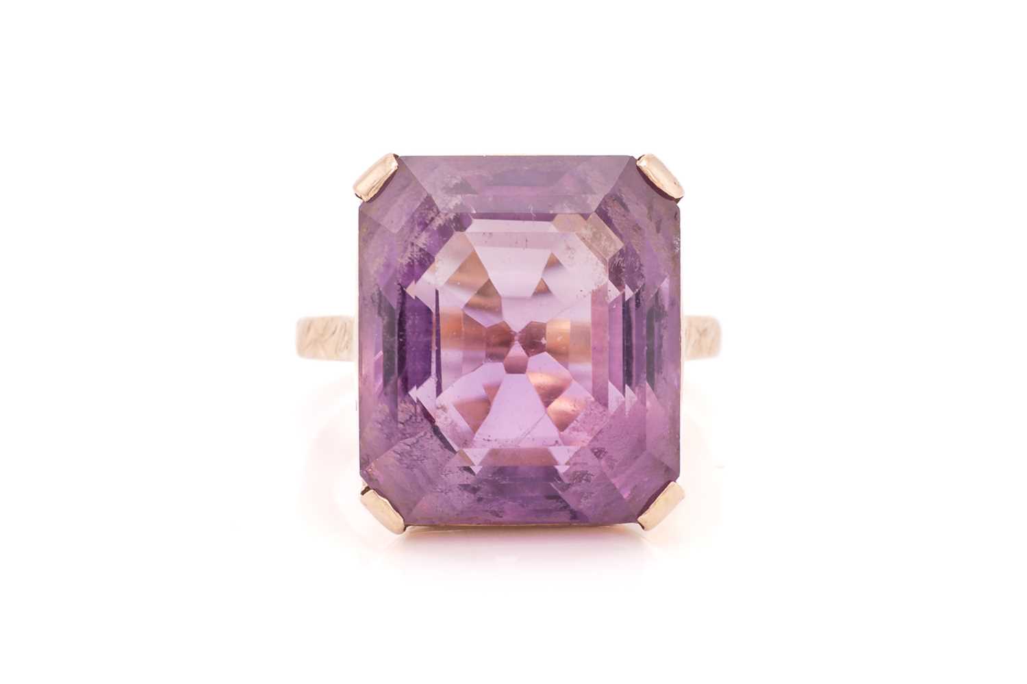 Lot 368 - An amethyst dress ring, comprising an...