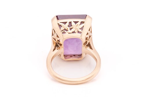 Lot 368 - An amethyst dress ring, comprising an...