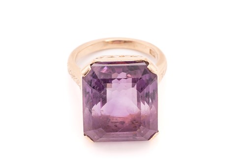 Lot 368 - An amethyst dress ring, comprising an...