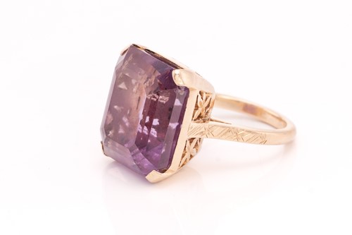 Lot 368 - An amethyst dress ring, comprising an...