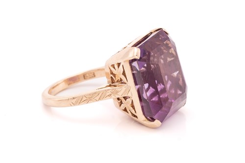 Lot 368 - An amethyst dress ring, comprising an...