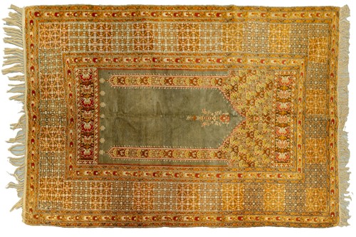 Lot 119 - An antique Turkish Ghiordes prayer rug with a...