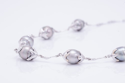 Lot 144 - A Tahitian pearl necklace, composed of seven...