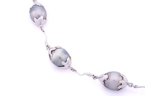 Lot 144 - A Tahitian pearl necklace, composed of seven...