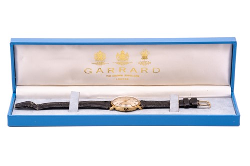 Lot 402 - An 18ct gold Omega Genève wristwatch,...