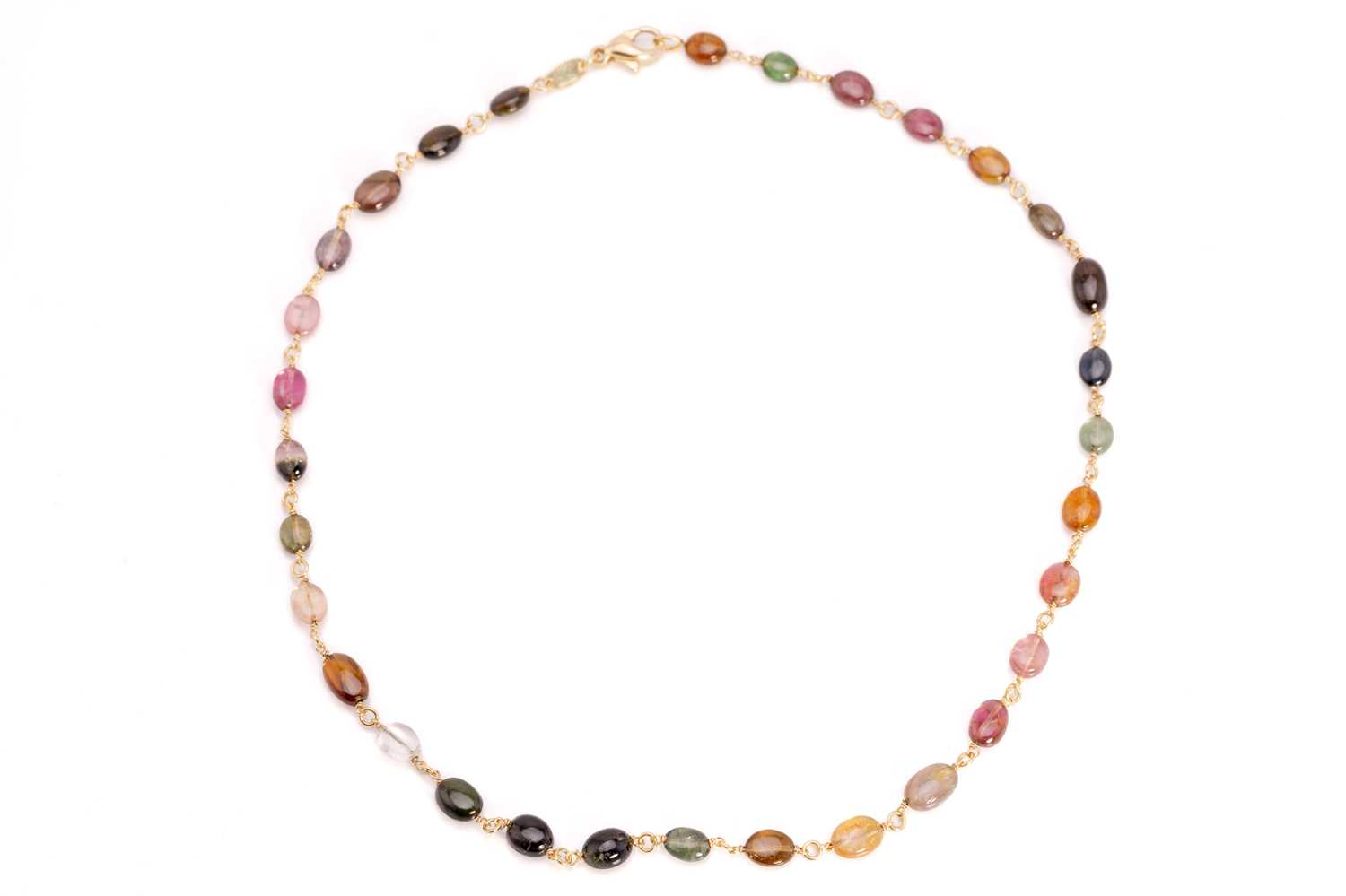 Lot 57 - A multi-gem bead necklace in 18ct yellow gold,...