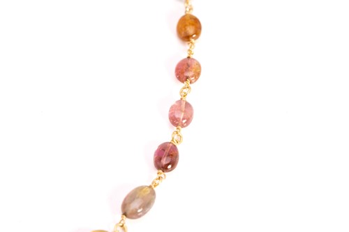 Lot 57 - A multi-gem bead necklace in 18ct yellow gold,...