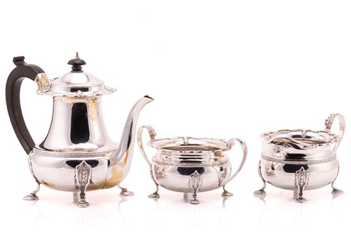 Lot 445 - A three piece silver coffee set; shaped...