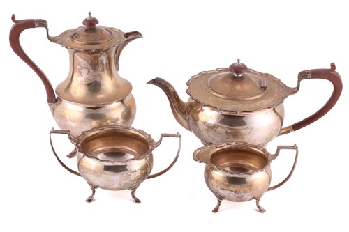 Lot 453 - A 1920s silver four-piece silver tea set,...