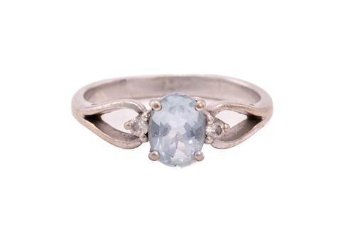 Lot 214 - A diamond eternity ring and a topaz trilogy...