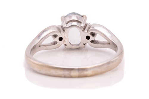 Lot 214 - A diamond eternity ring and a topaz trilogy...