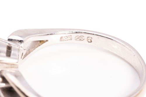 Lot 214 - A diamond eternity ring and a topaz trilogy...