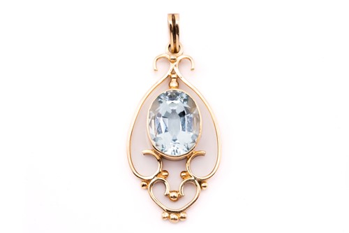 Lot 306 - An aquamarine pendant, featuring an oval...