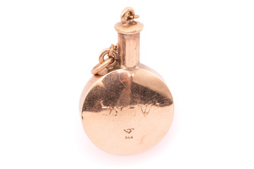 Lot 58 - A gem-set perfume bottle charm, one side of...