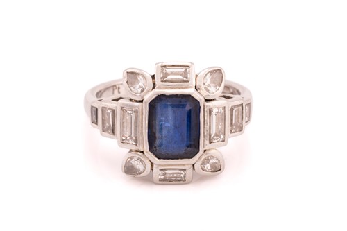 Lot 217 - A sapphire and diamond dress ring, composed of...