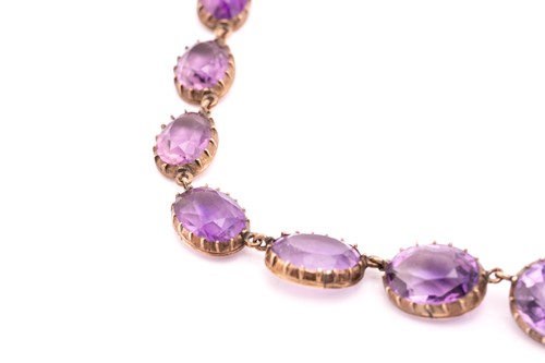 Lot 152 - An amethyst rivière necklace, composed of...