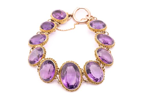 Lot 350 - An amethyst bracelet, composed of ten...