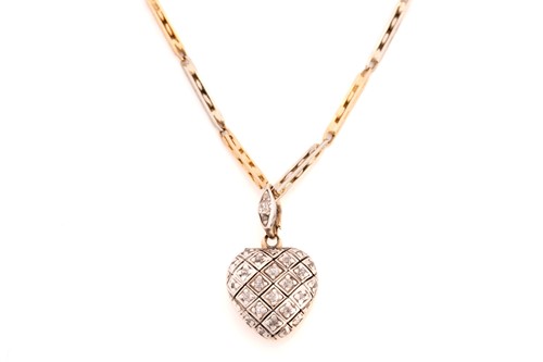 Lot 280 - A diamond-set heart locket on a watch chain,...