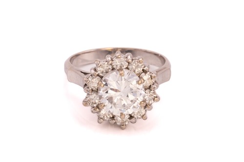 Lot 359 - A diamond cluster ring, formed from a central...