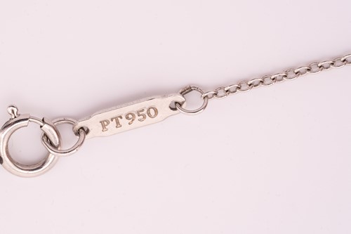 Lot 118 - Tiffany & Co. - a diamond cross pendant on...