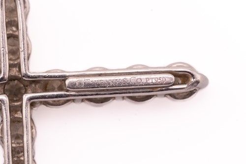 Lot 118 - Tiffany & Co. - a diamond cross pendant on...