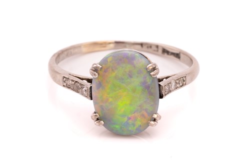 Lot 78 - An opal and diamond dress ring, claw-set with...