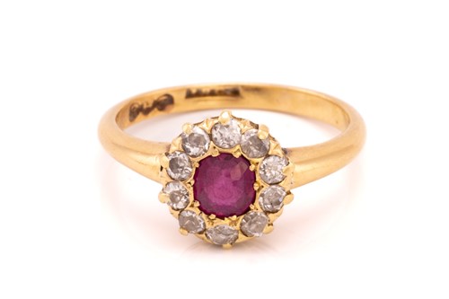 Lot 313 - A ruby and diamond cluster ring, comprising a...