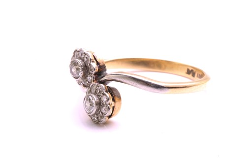 Lot 44 - A diamond Toi et Moi crossover ring,...
